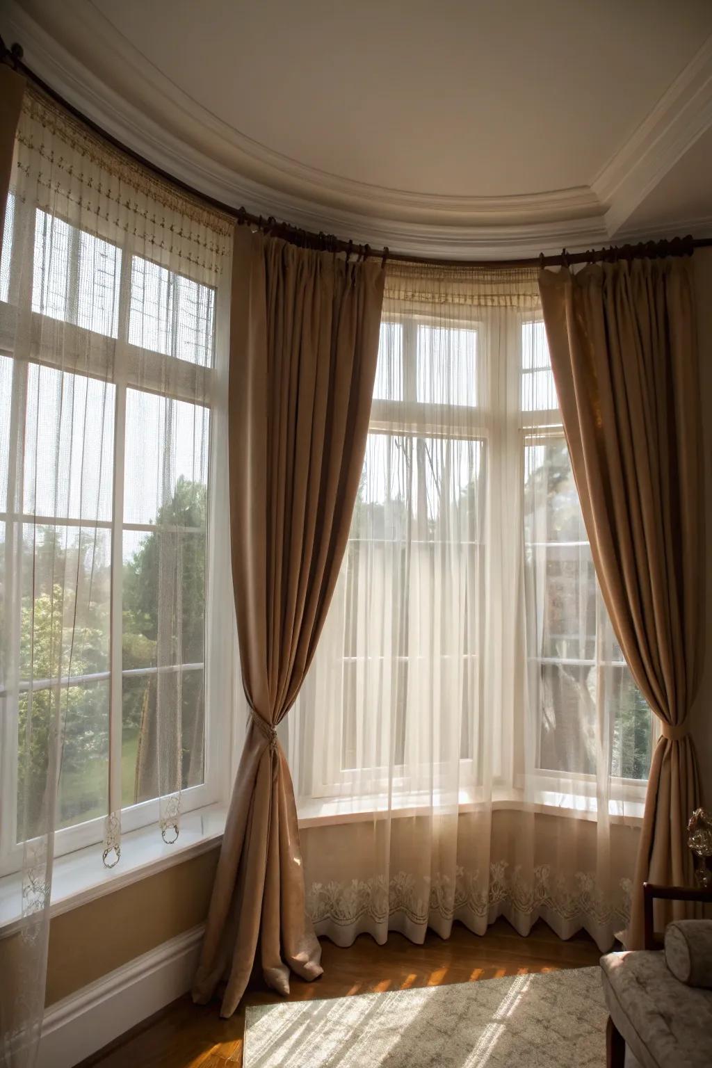 Layered curtains provide adaptability and flair for your bay windows.