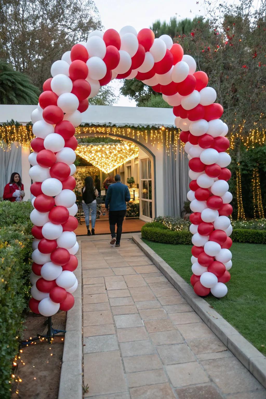 Extend a warm welcome to your guests with a charming peppermint balloon arch.