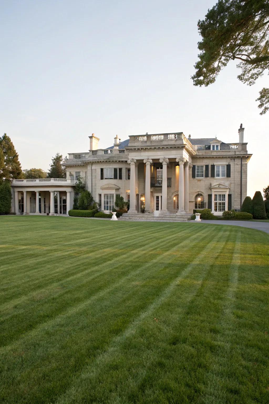 A magnificent residence boasting a refined facade and expansive front lawn.