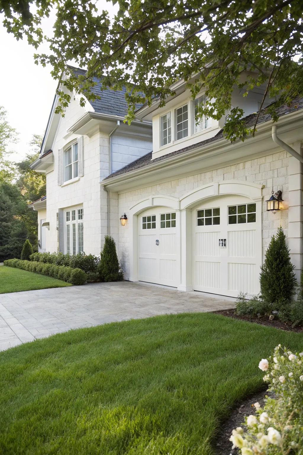 A white garage entry showcases timeless beauty and refinement.