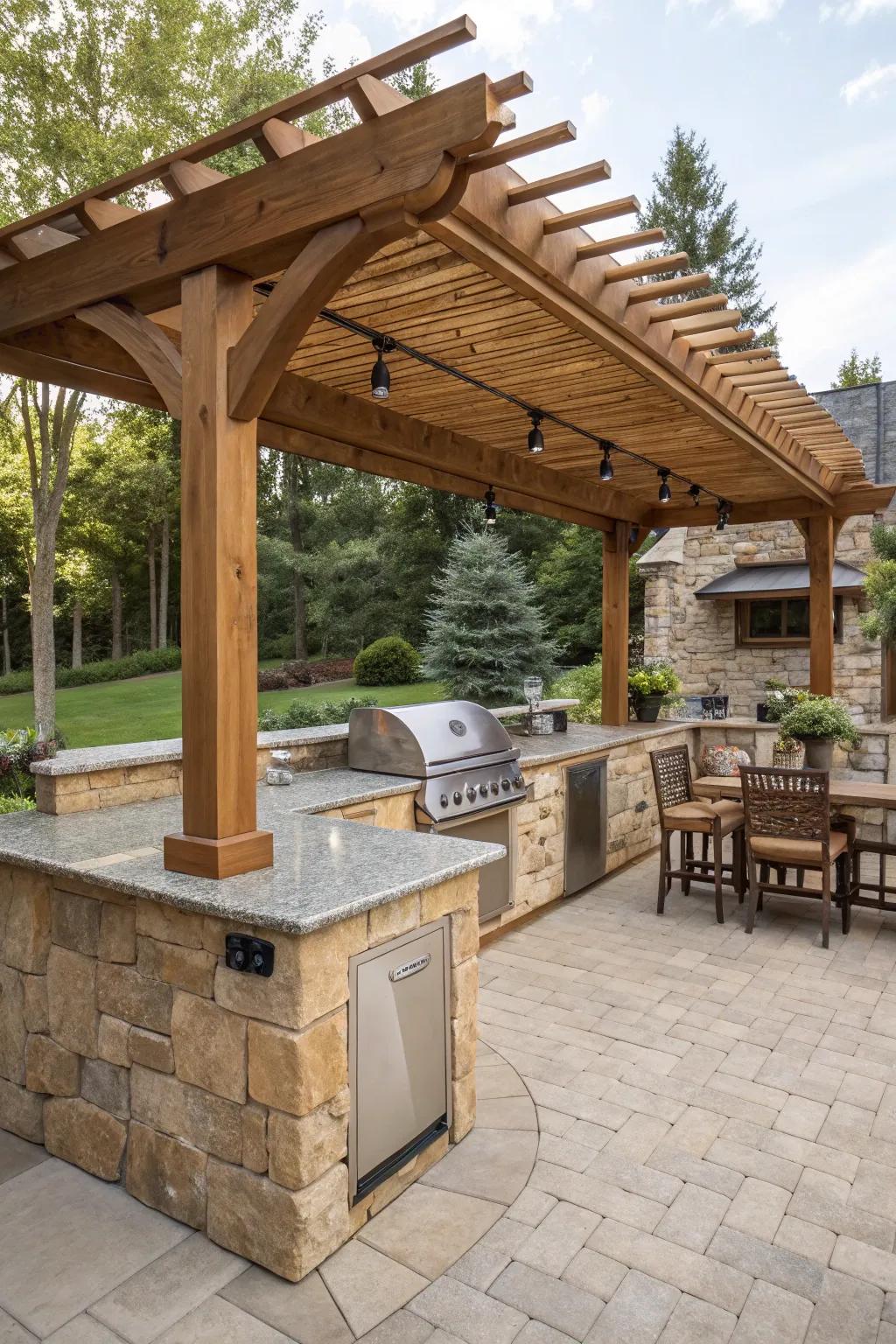 Timeless timber structure over an outdoor kitchen with a stone counter.