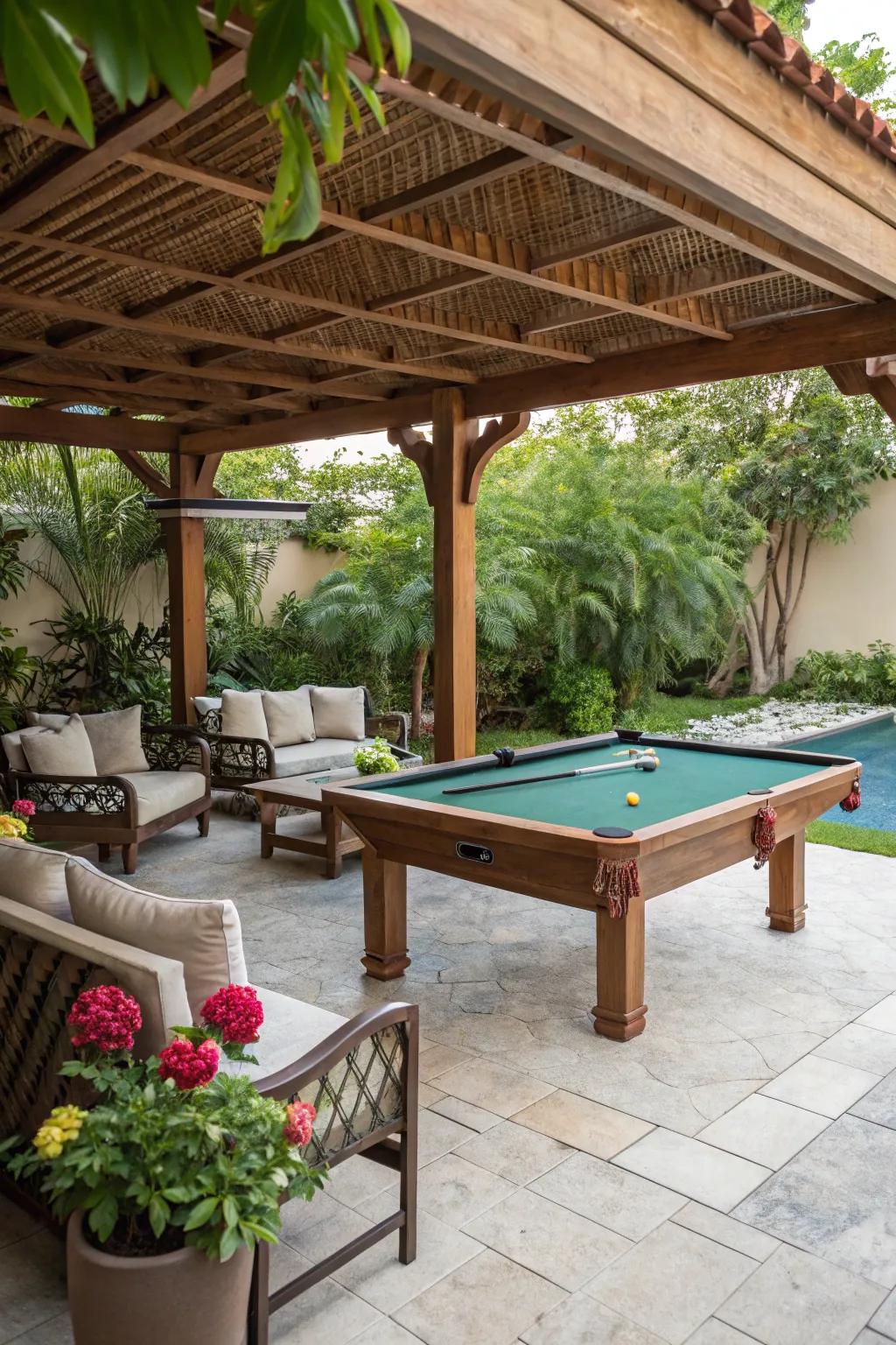 A welcoming game table setup beneath a timbered structure, complete with seating and foliage.