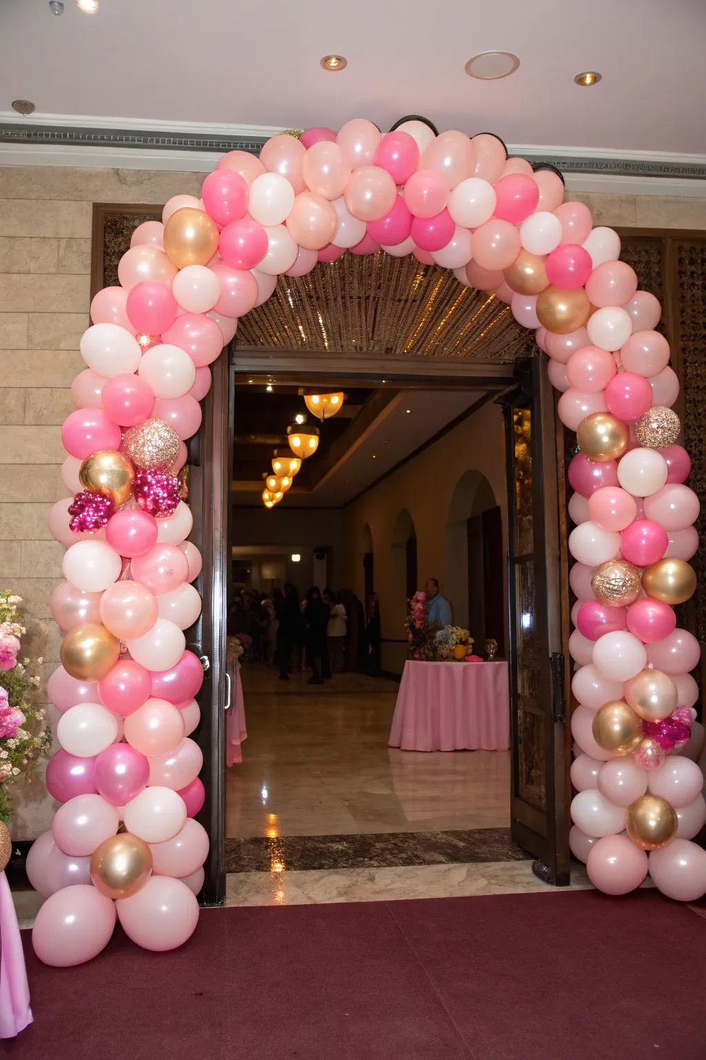 A pink balloon archway sets a festive tone from the start.