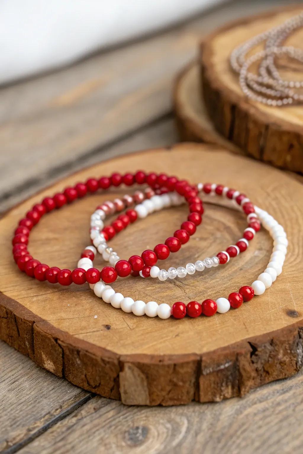 Stylish scarlet and ivory stone string bracelets add a touch of flair to any outfit.