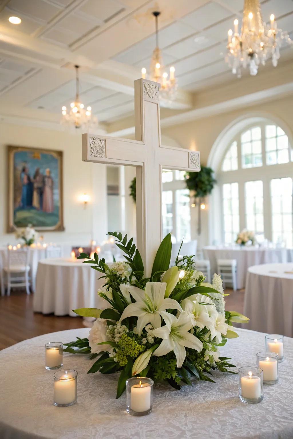 A centerpiece featuring a cross, bordered by blossoms and candle lights.