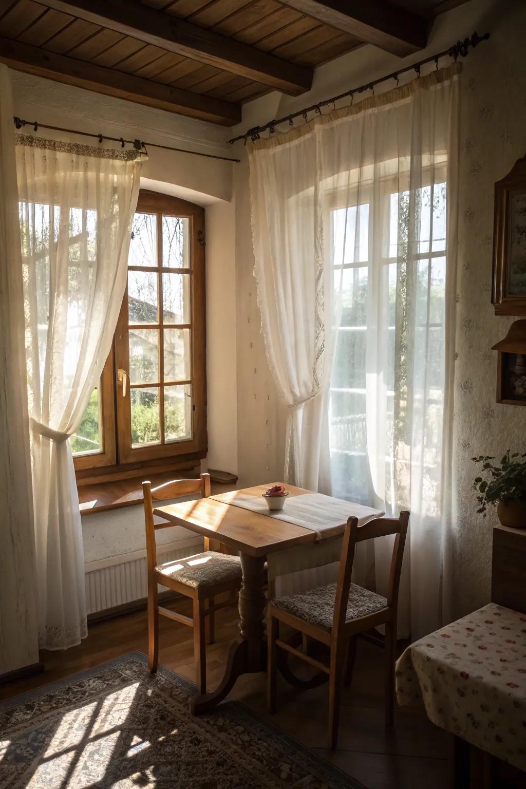 Sheer curtains offer a bright and breezy atmosphere in a compact dining space.
