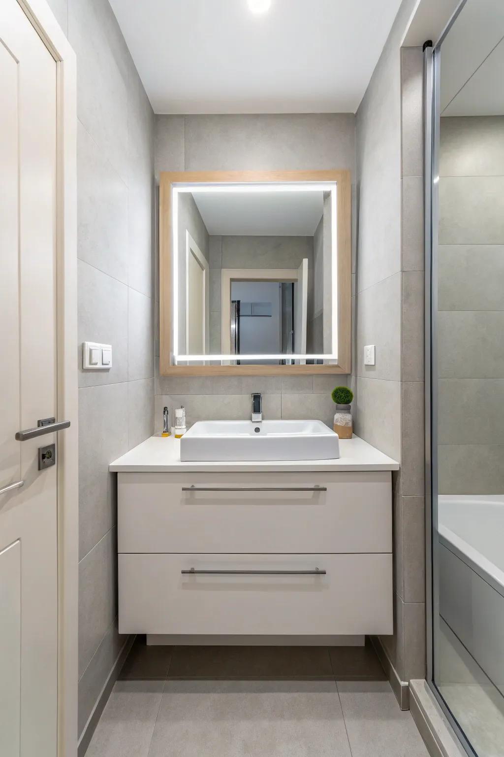 A small, modern bathroom features a floating vanity to maximize the feeling of spaciousness.