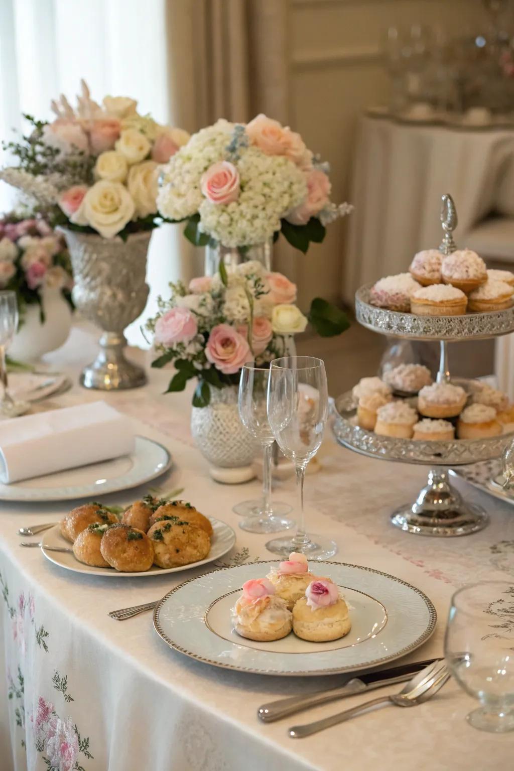 An elegantly arranged table featuring fresh flowers and a variety of breakfast choices.