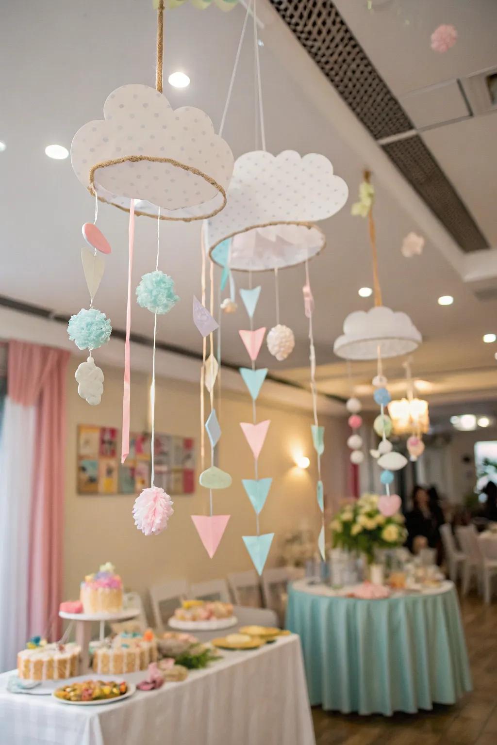 Do-it-yourself cumulus mobiles introduce a handmade, whimsical element to the baby shower decorations.