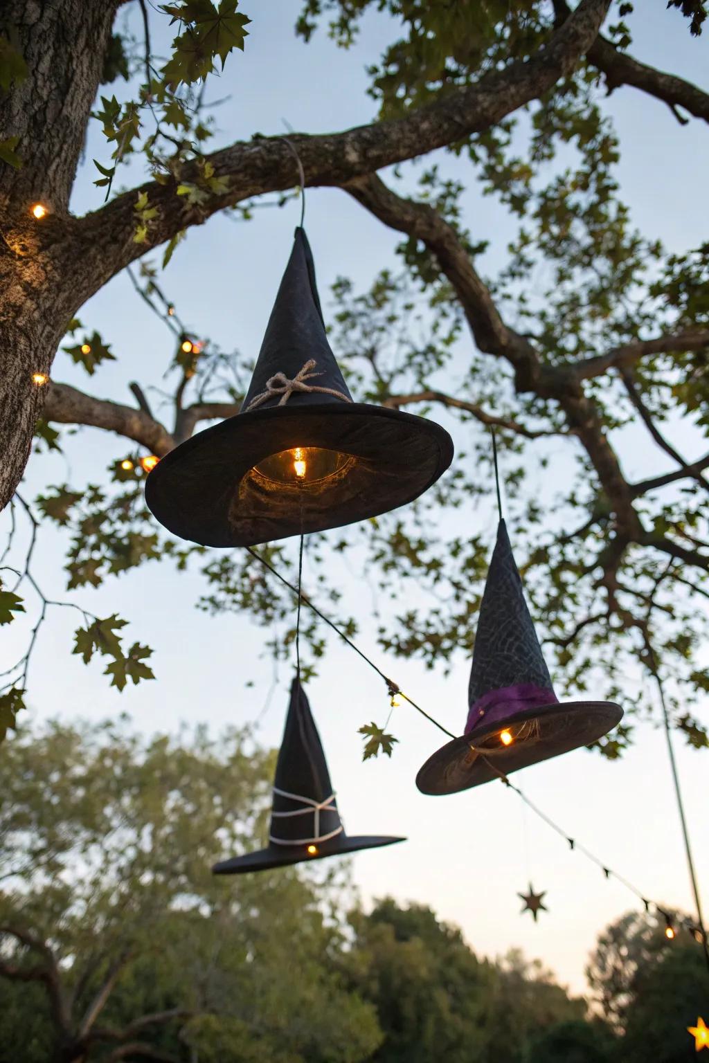 Floating witch hats create a whimsical and enchanting outdoor display.