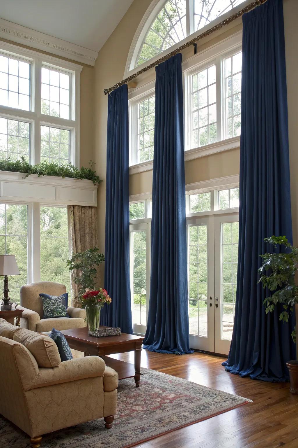 Elegant full-length drapes impart height and drama to this chic living room.