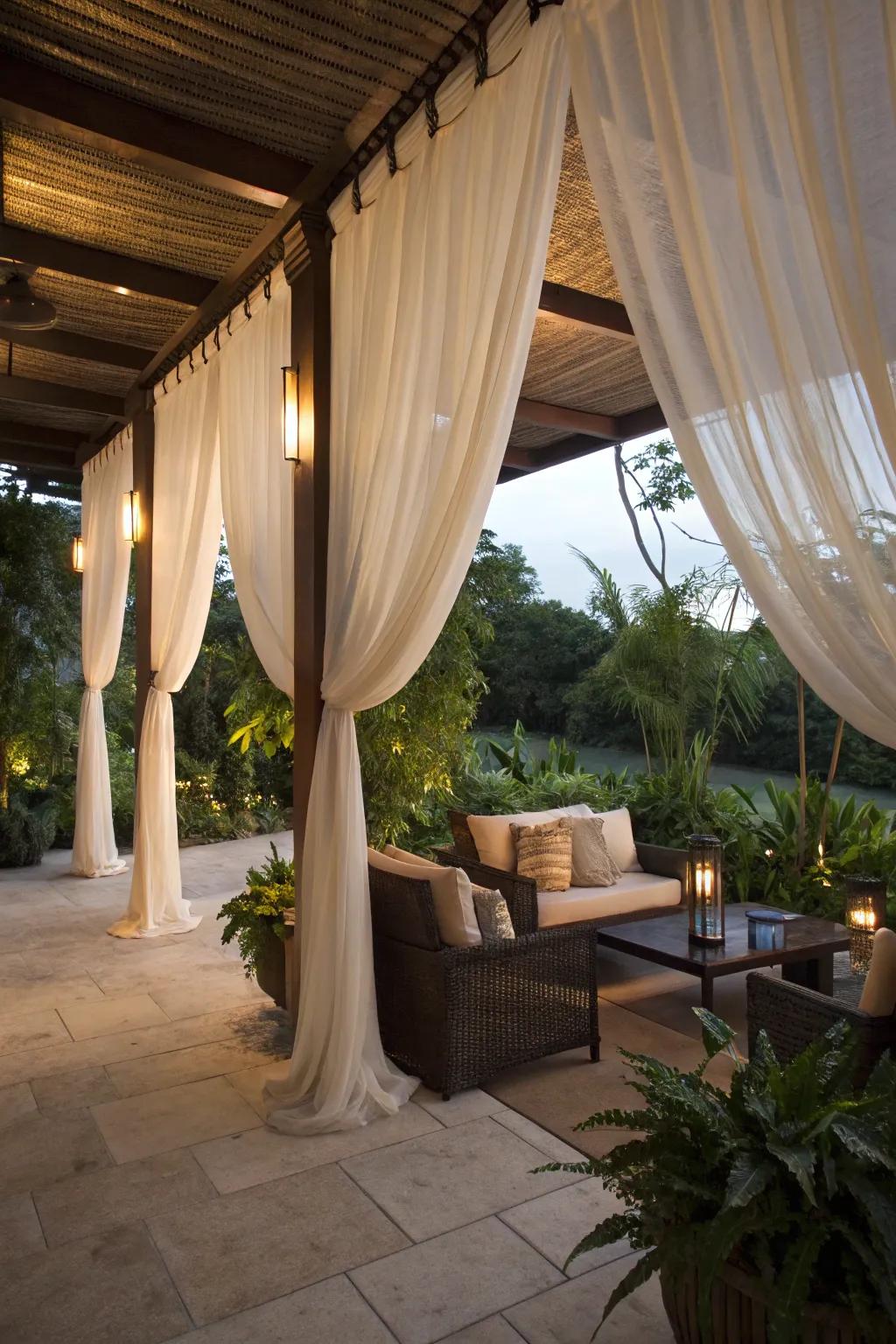 Elegant fabrics crafting a snug and private patio space.