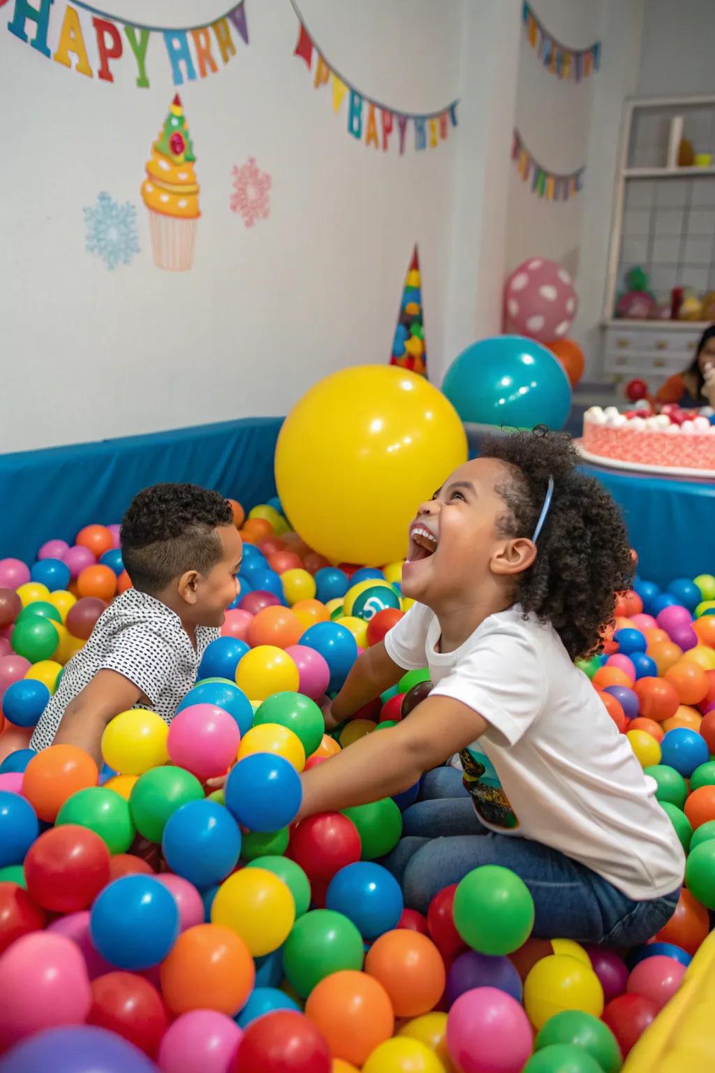 A vibrant orb pit ensures giggles and elation at a first birthday celebration.