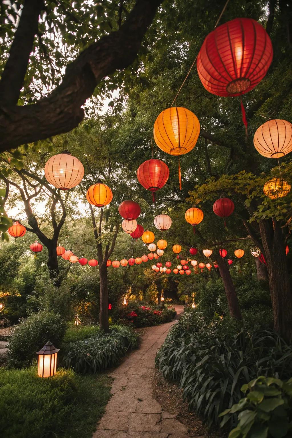 A garden party is enhanced by the addition of vibrant paper lanterns.