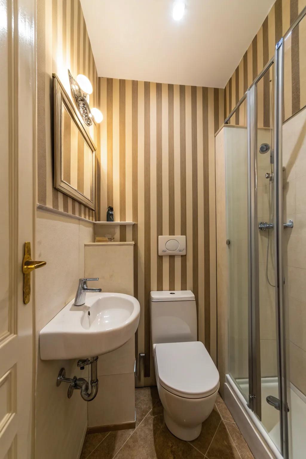Vertical stripes impart height to this compact bathroom.