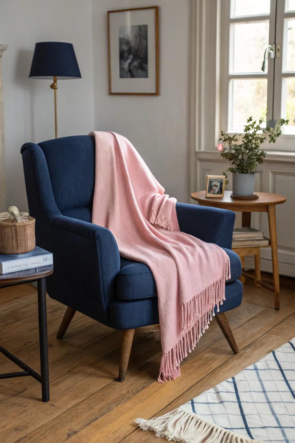 A rose throw adds warmth and color to a sapphire armchair.