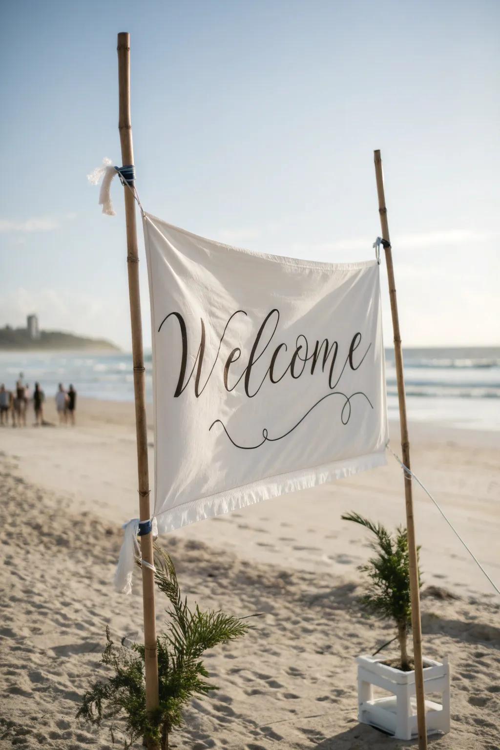 A soft fabric banner welcome board, perfect for creating a romantic feel at a beach wedding.