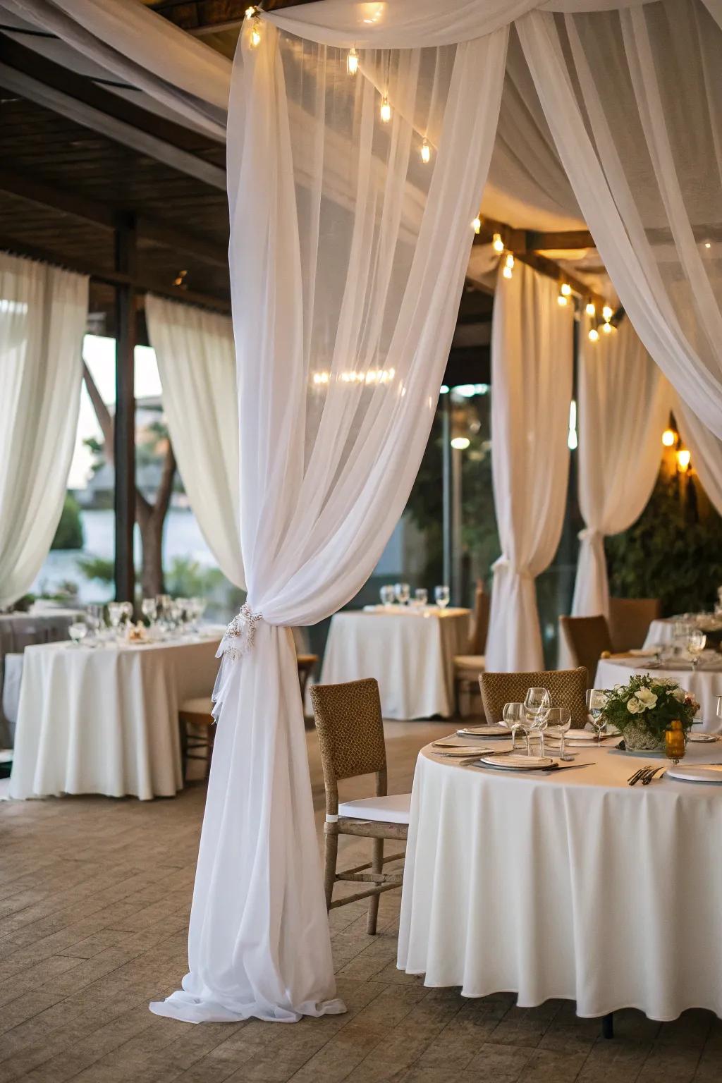White fabric curtains contribute elegance and drama to the meal setting.
