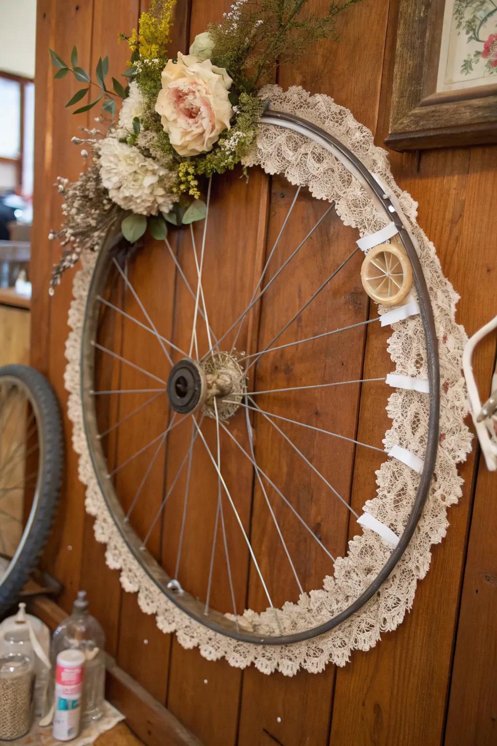 A vintage bike wheel decoration with lace and trinkets for a nostalgic charm.