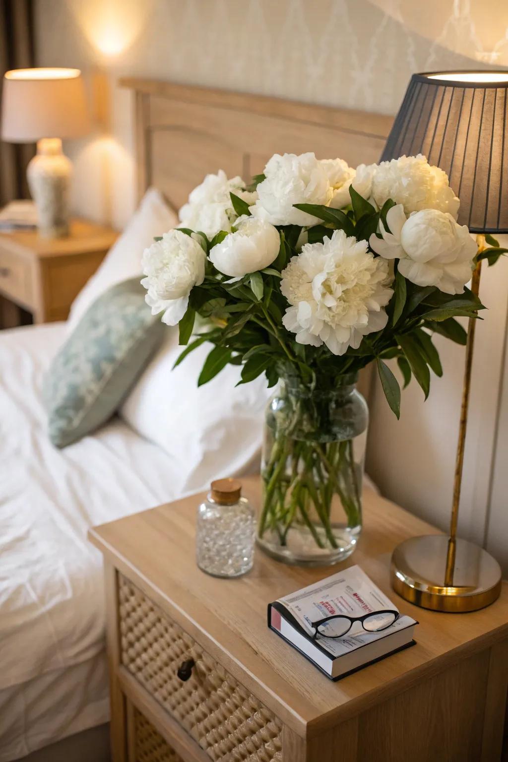 Ivory peonies contributing romance to a sleeping quarter setting.
