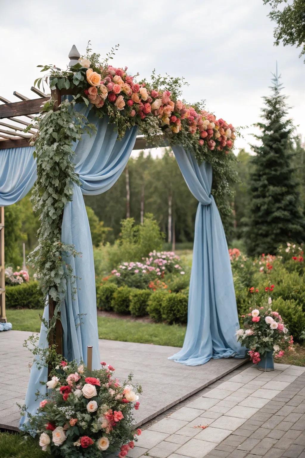 A stunning ceremony archway with soft teal details, creating a memorable ceremony backdrop.