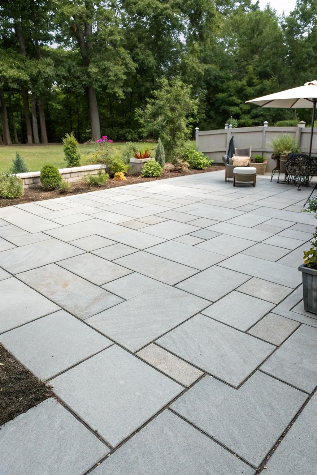 Oversized pavers fashion a neat and modern patio appearance.