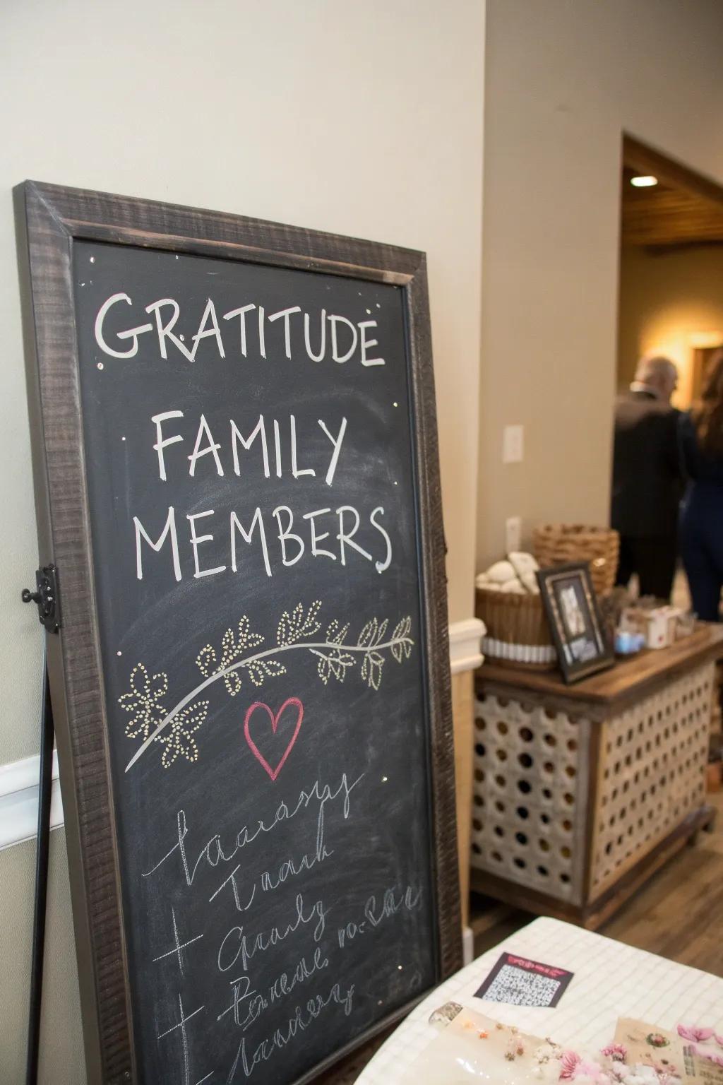A chalkboard filled with handwritten notes of thankfulness from family members.