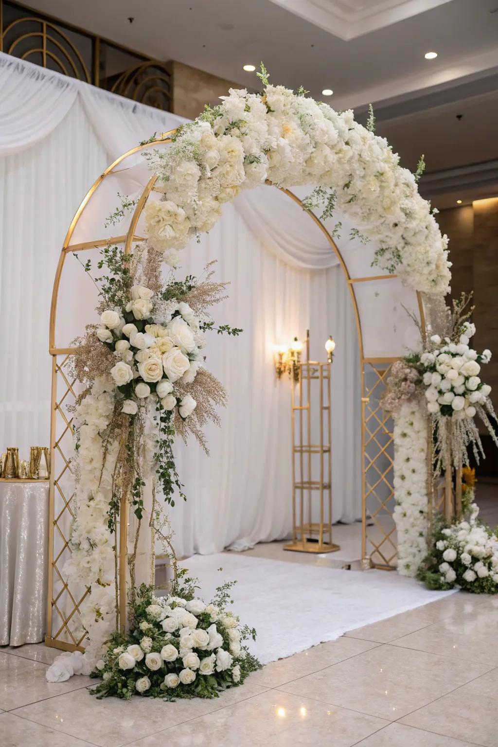 Grand entrance with a flowery arch in white and gold.