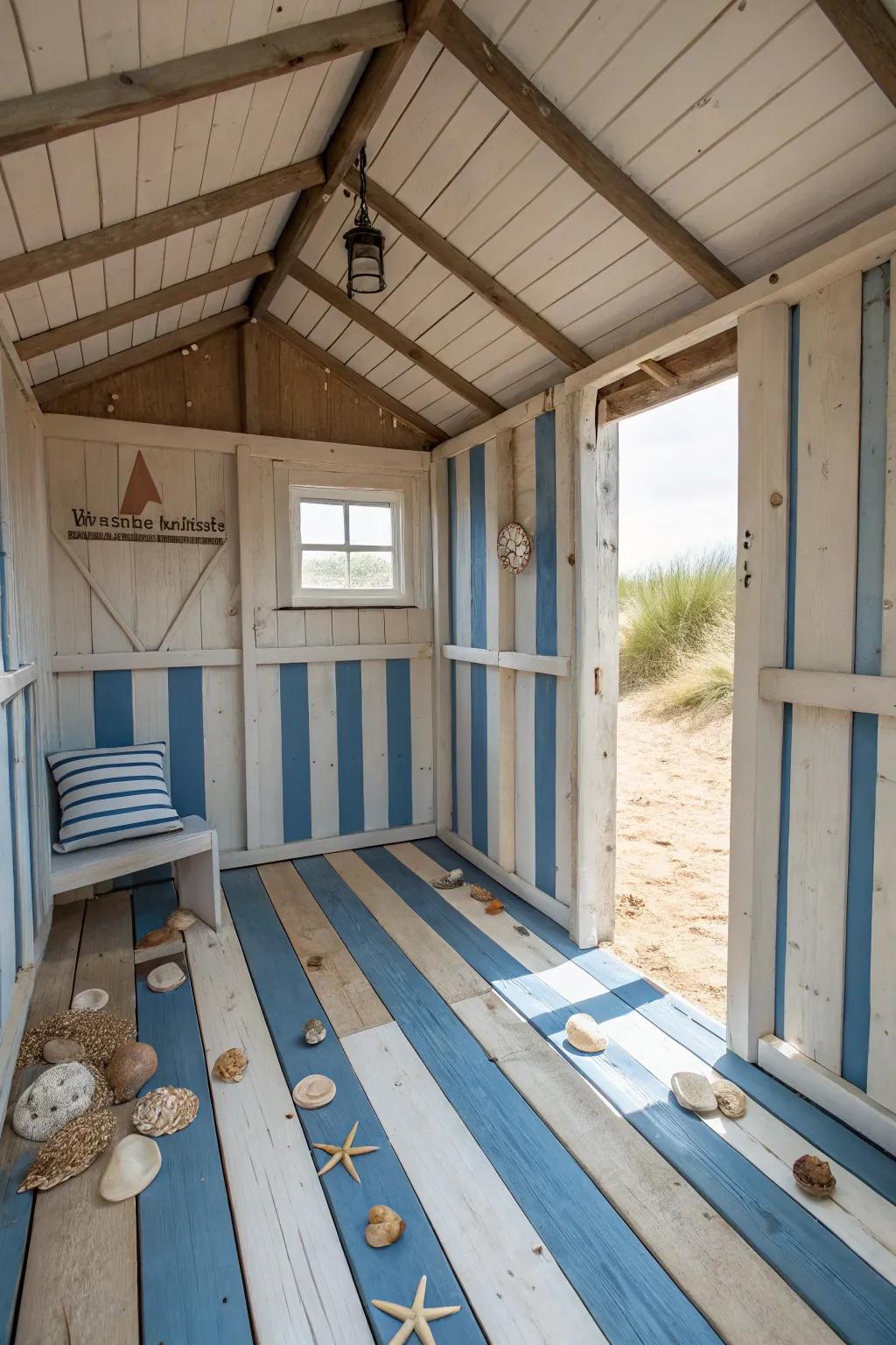 Painted floorboards in marine stripes brighten the beach shed interior.