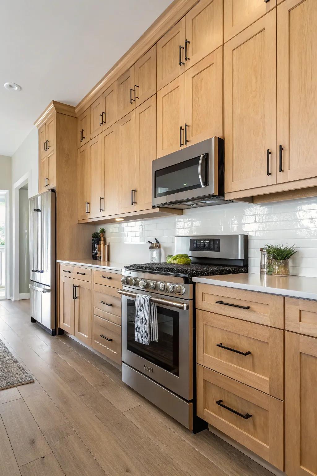 Sleek hardware adds a modern touch to cream-colored pecan wood cabinets.