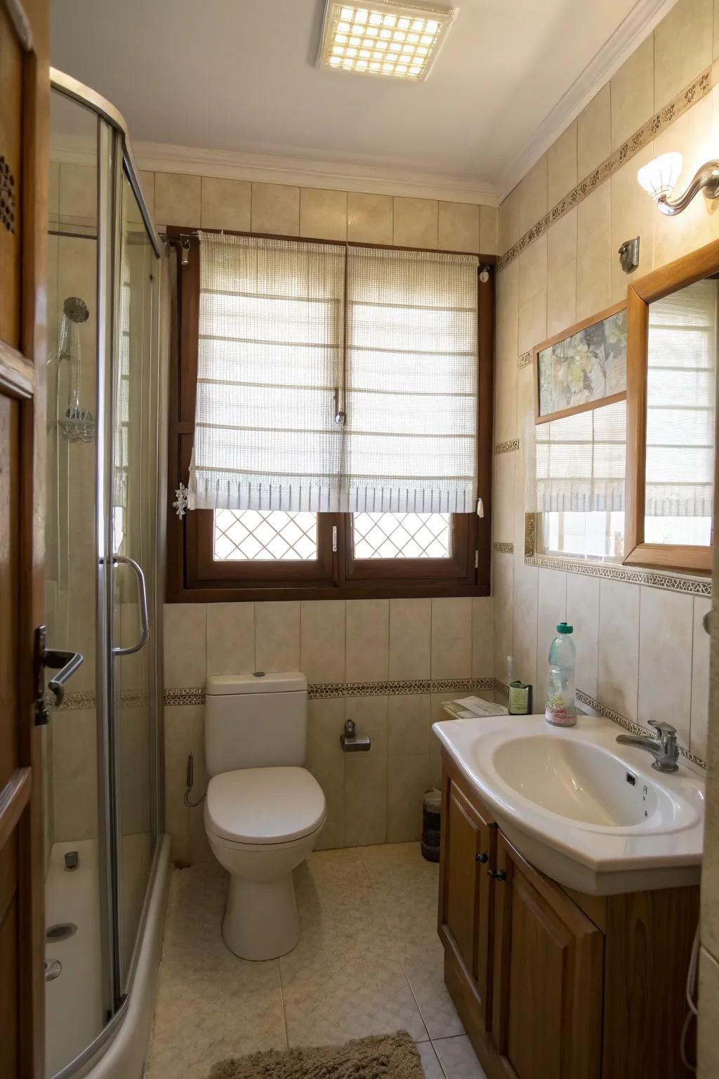 Translucent shades contribute privacy and illumination to this compact bathroom.