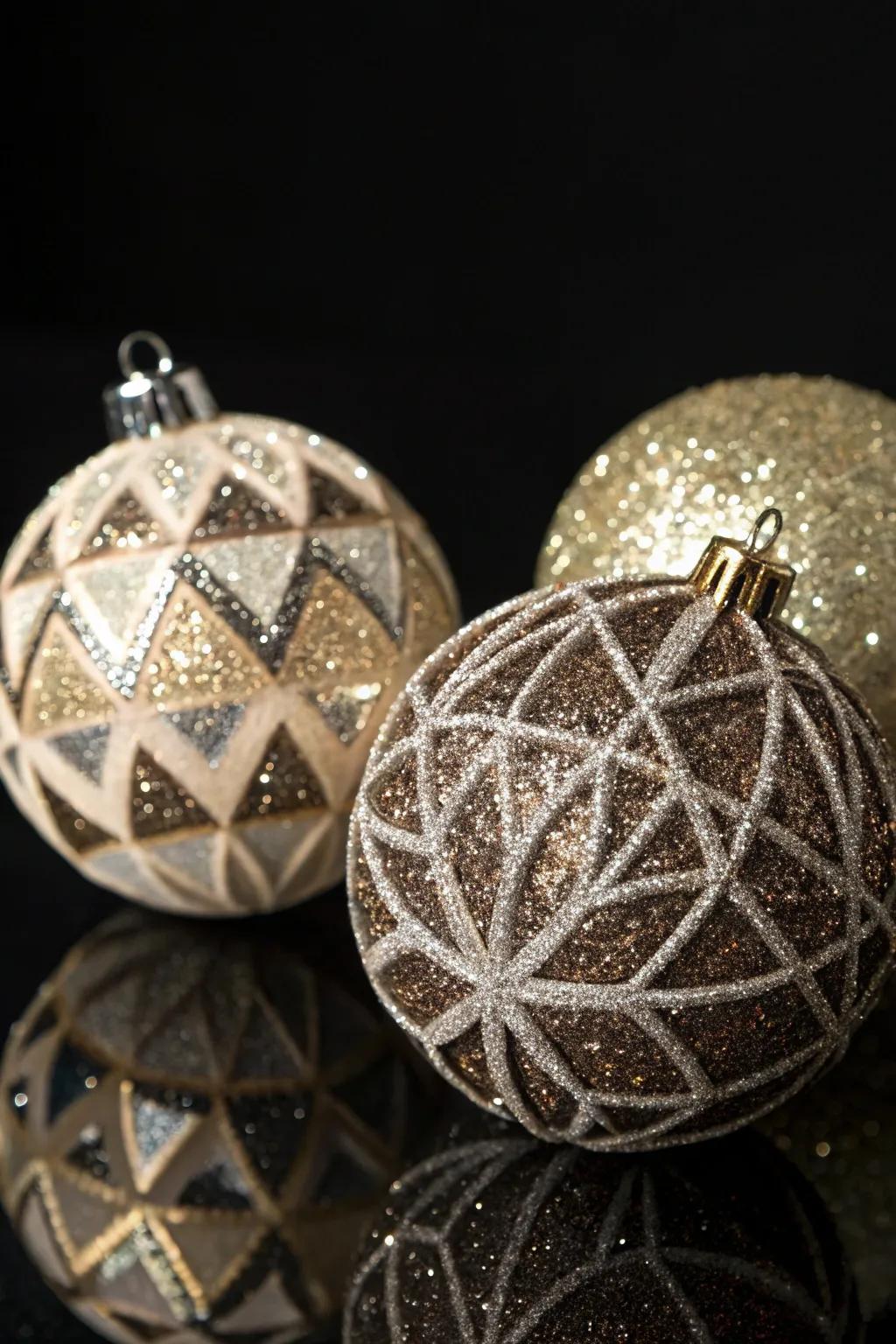 Geometric figures with sparkle contribute a modern shimmer to festive baubles.
