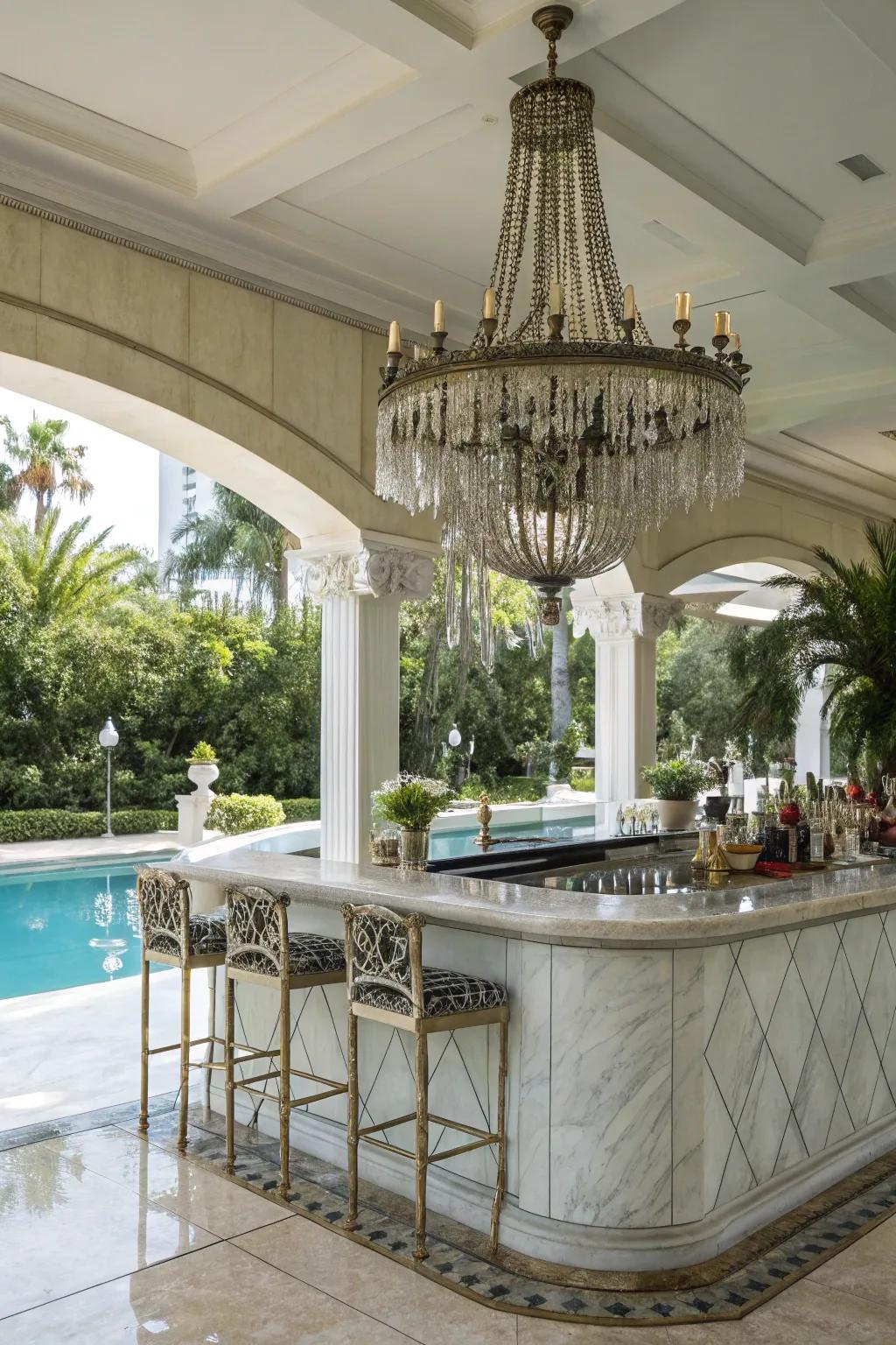 A marble wet bar boasting an illumination fixture introduces elegance to your outdoor space.