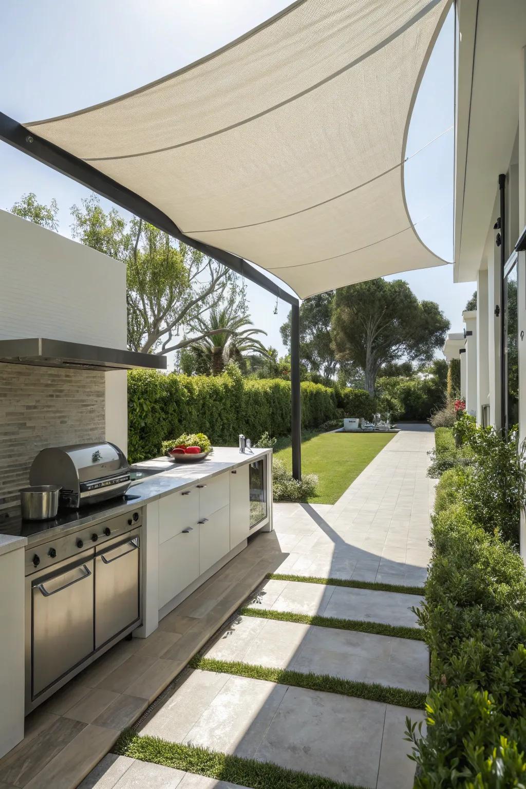 A sail shade gives a sleek and modern cover for your outdoor kitchen.