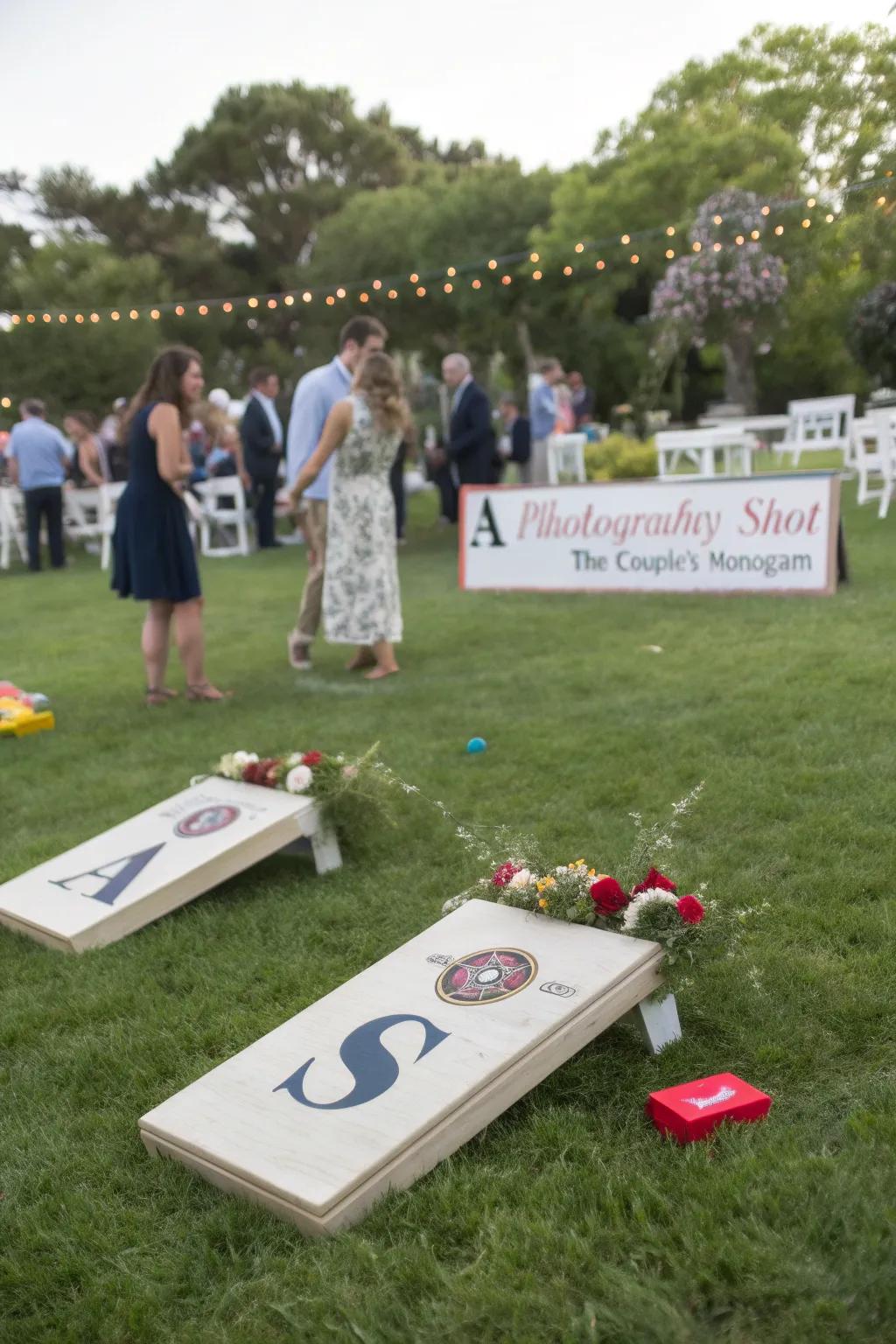 Personalized outdoor games at a wedding, featuring the couple's monogram and themed colors.