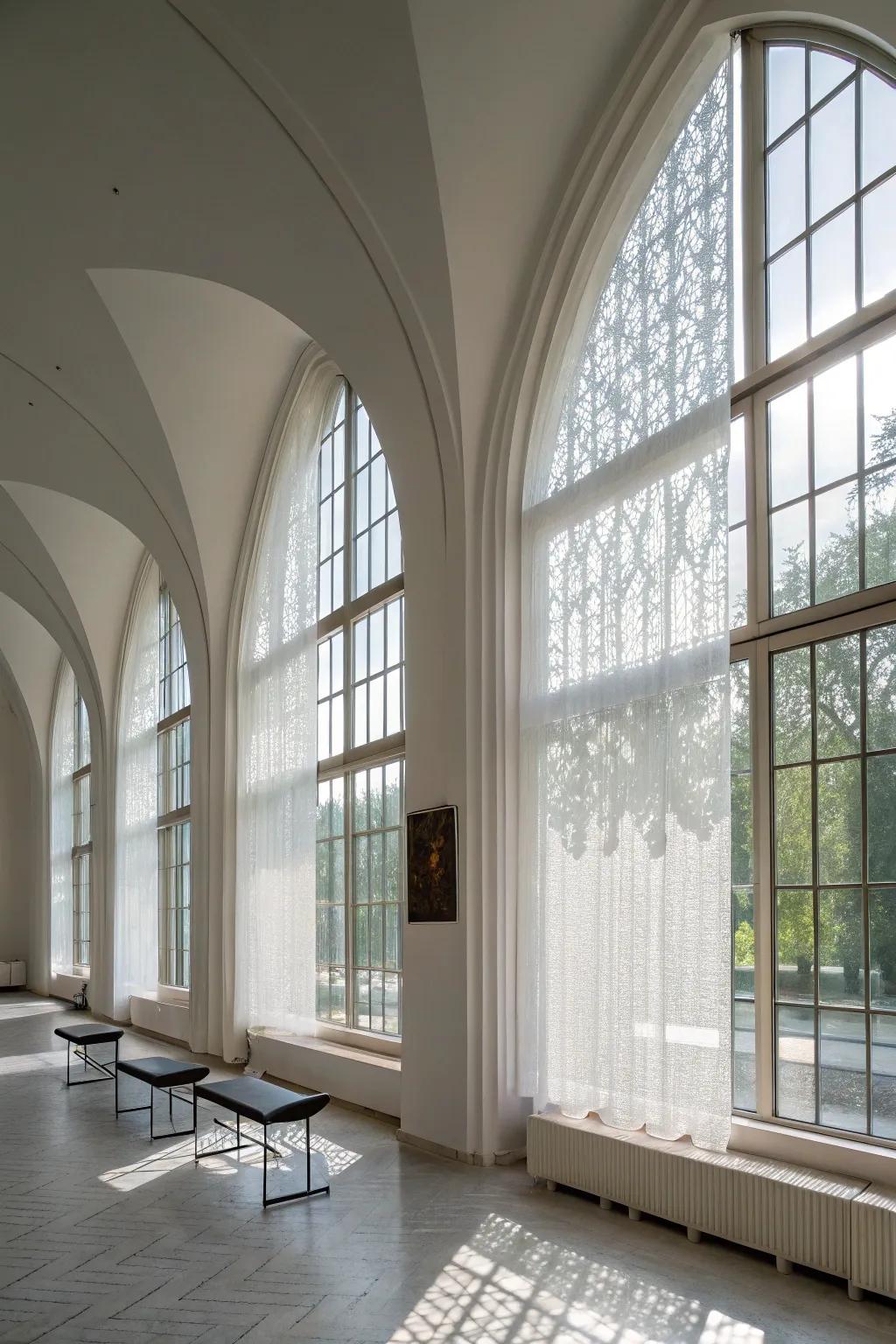 A contemporary minimalist space showcases translucent panels on arched windows.