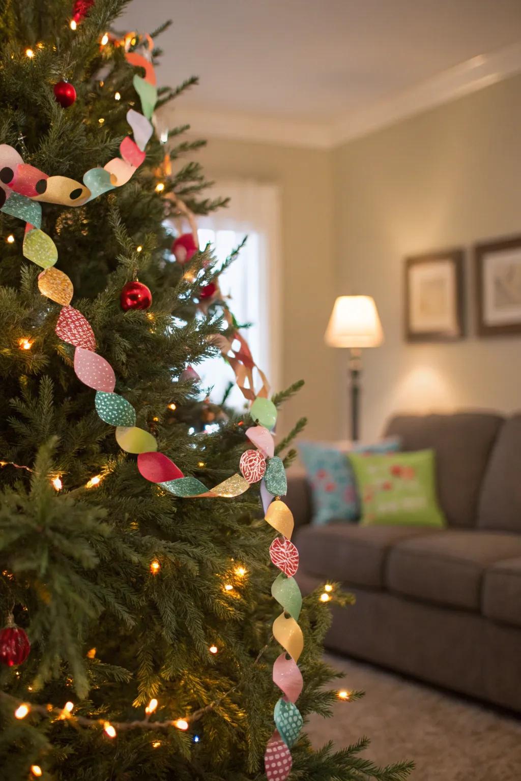 A Christmas tree designed with a vibrant paper ribbon garland.
