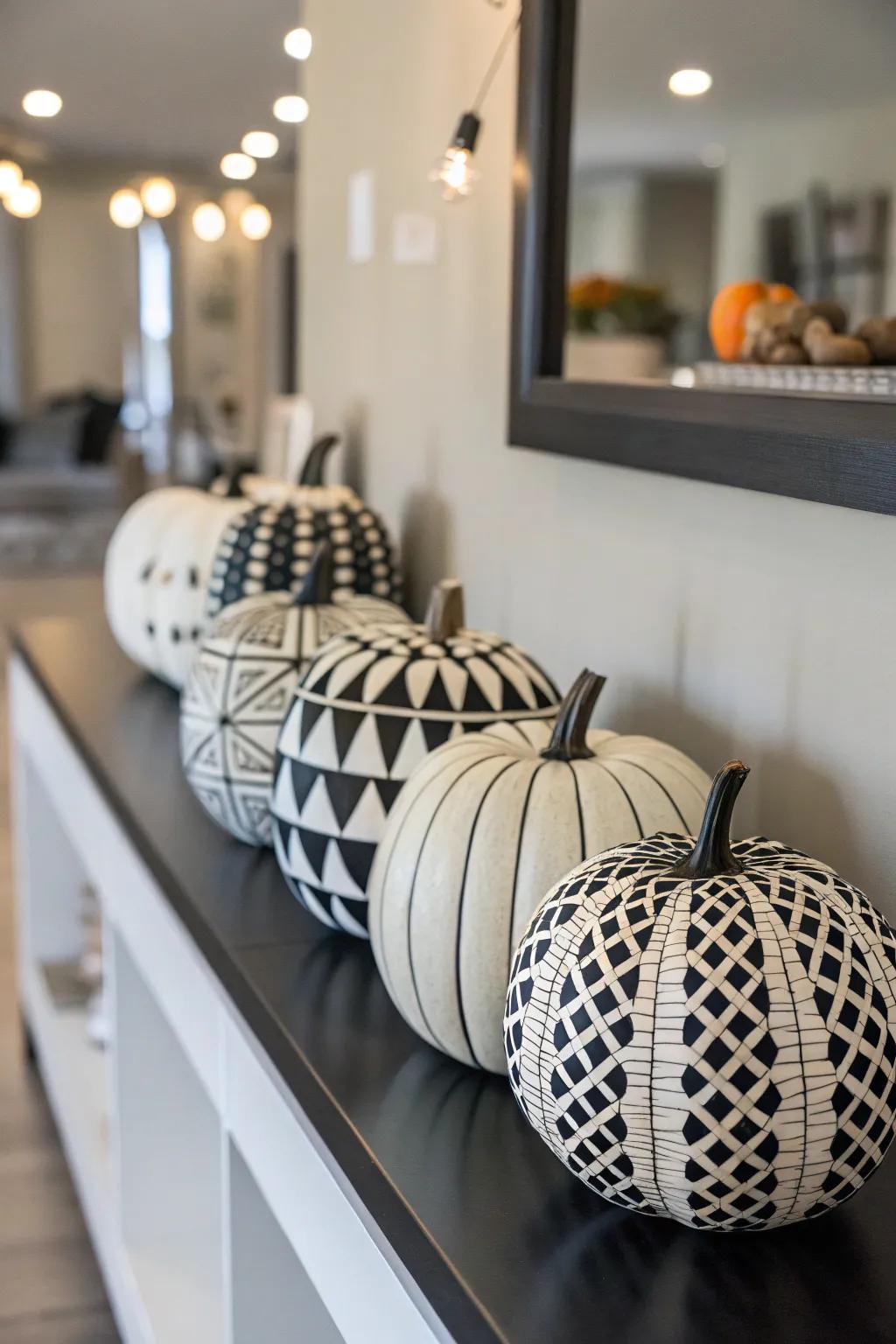 Chic black and white pumpkins with geometric patterns.