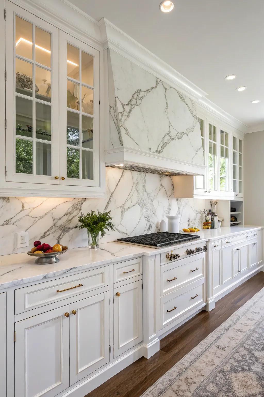 Granite backsplashes add a refined touch to this sleek white kitchen.