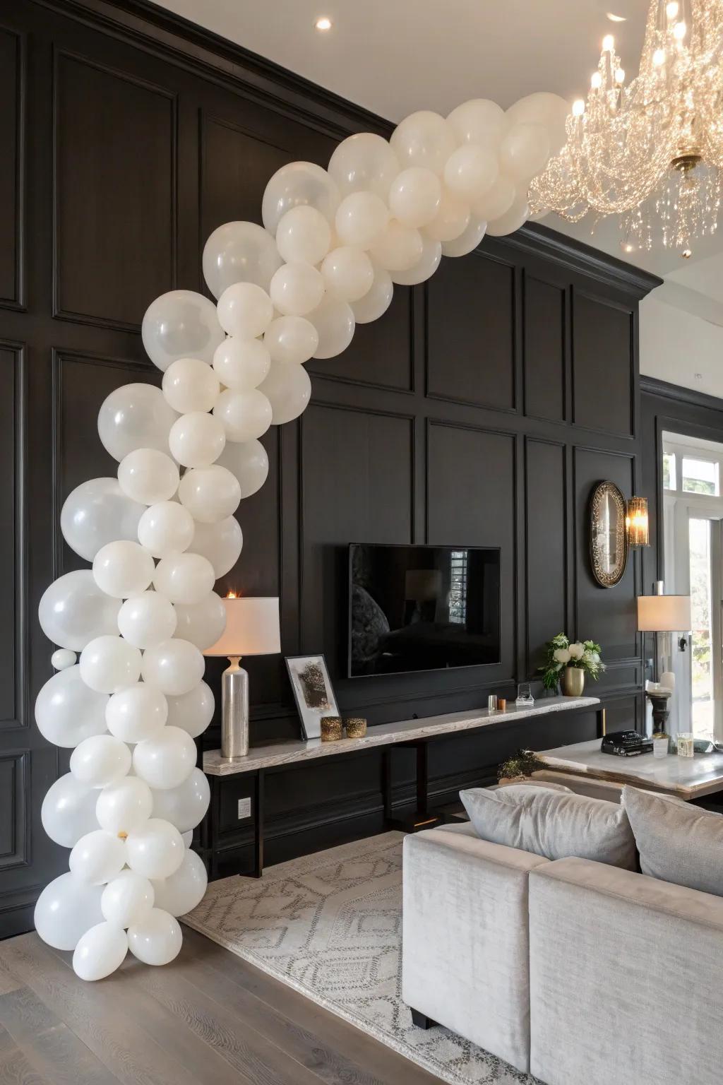 Classy white balloon garland adding elegance to a chic setting.