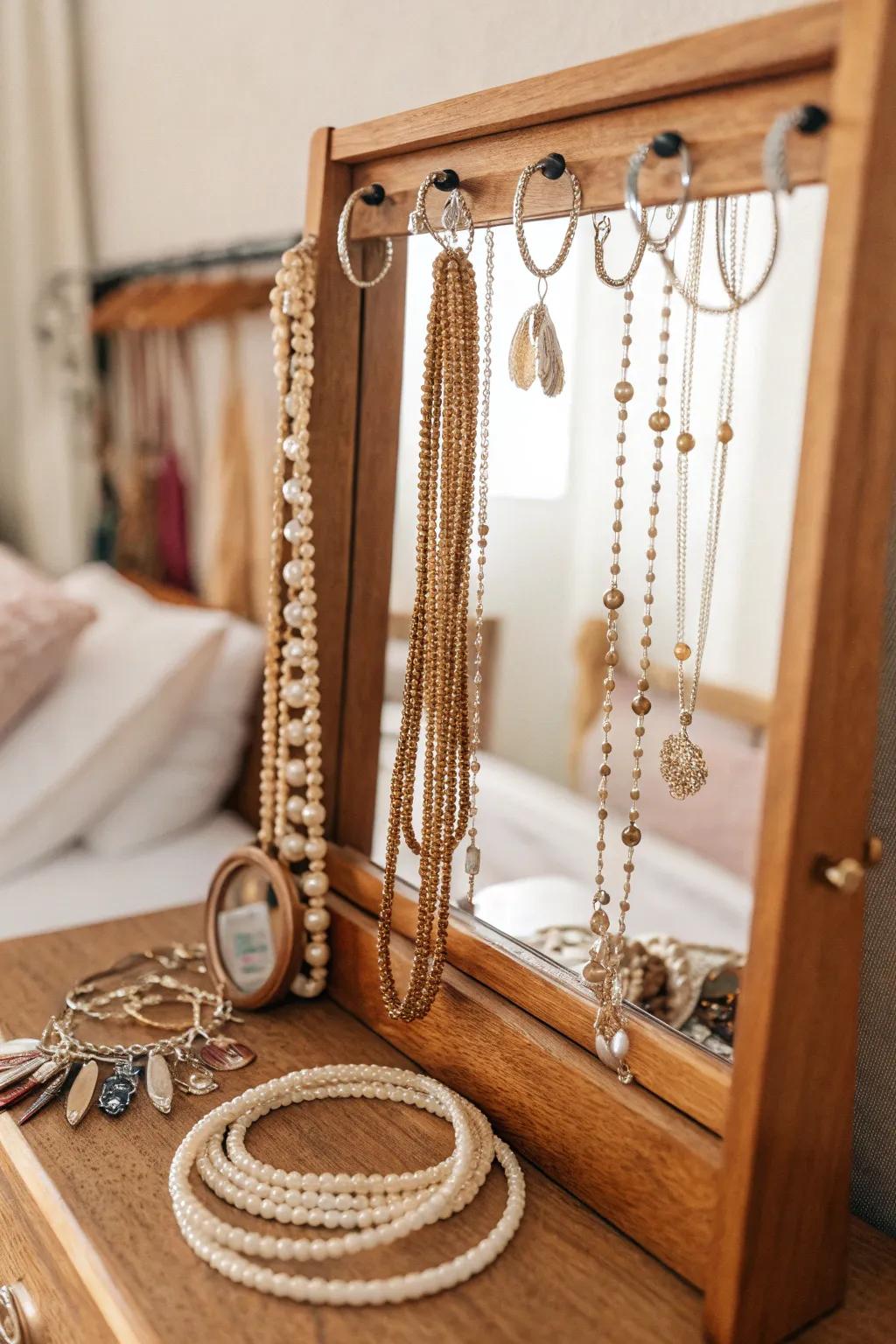 Refined mirror adorned with jewelry hooks