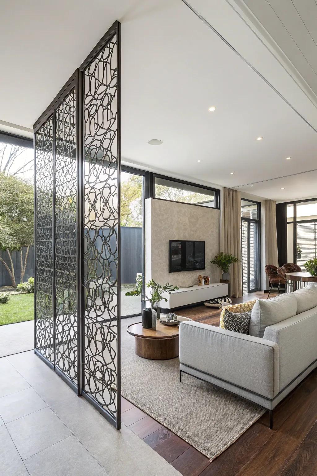 An elegant metal screen wall delineates clear zones in a spacious, open-plan living space.