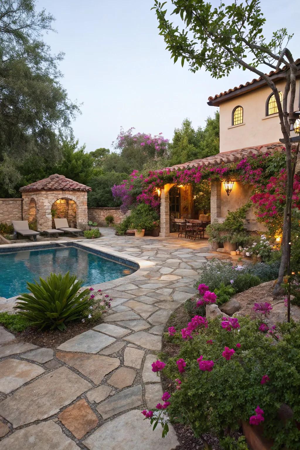 Natural stone patios lend a rustic charm to this Spanish-style pool area.