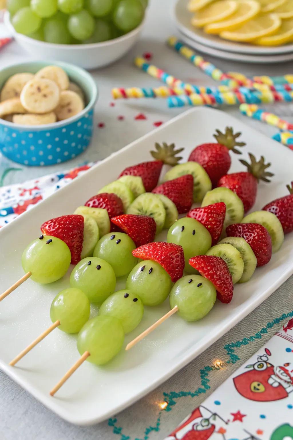 Whimsical Grinch fruit kabobs to liven up your holiday party.