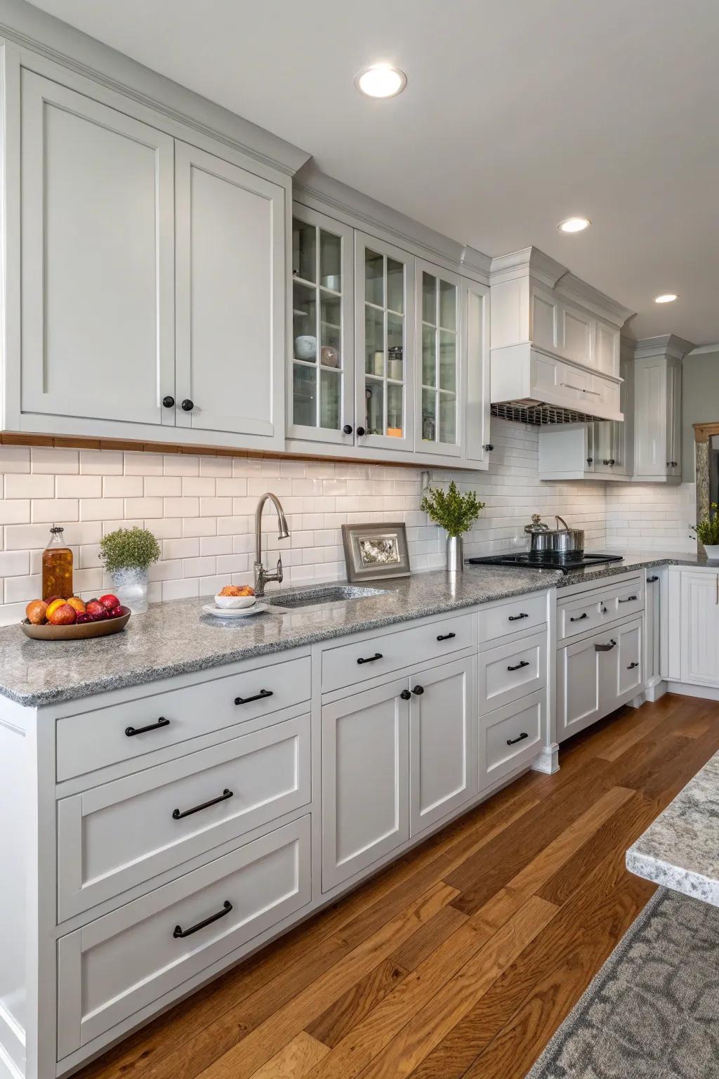 Grey surfaces beautifully complementing ivory cabinetry.