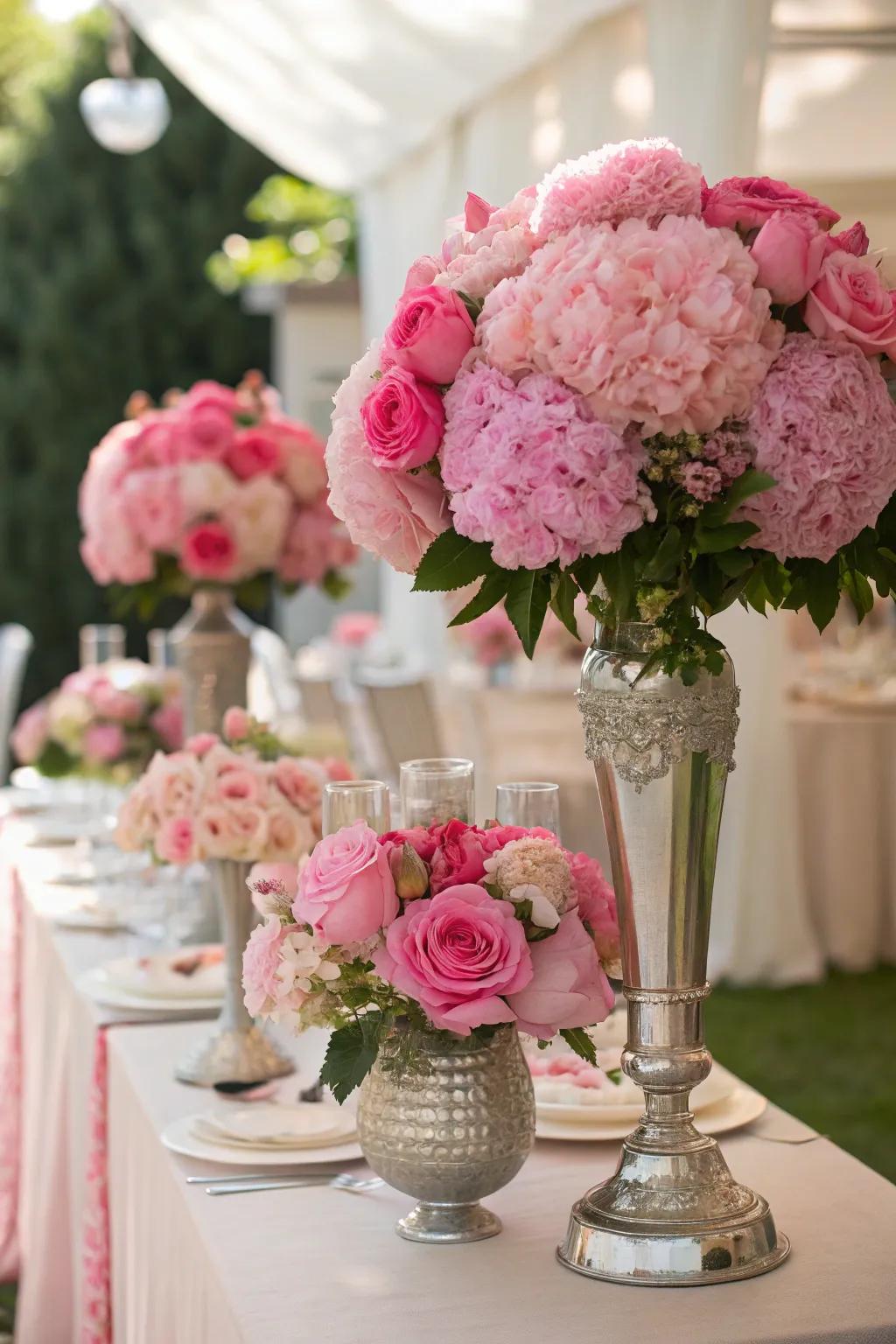 Pink floral arrangements bring life and elegance to the party decor.