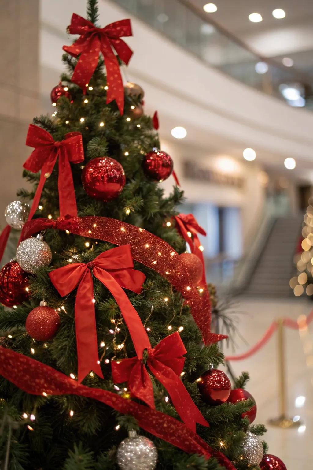 Scarlet ribbons and bows add an elegant touch to the tree.