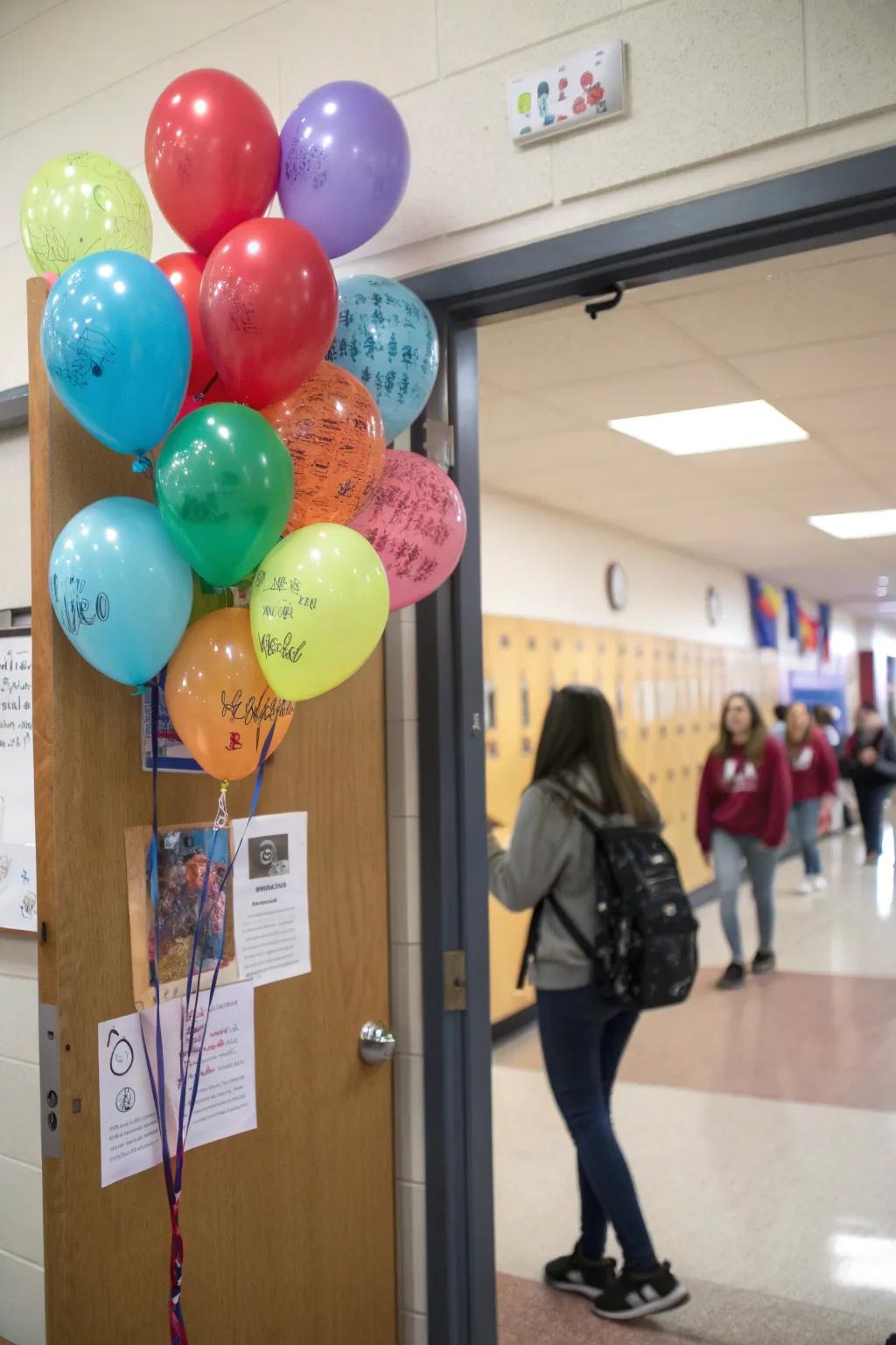 An interactive classroom entrance featuring air-filled decorations for pupils to pen benevolent messages.