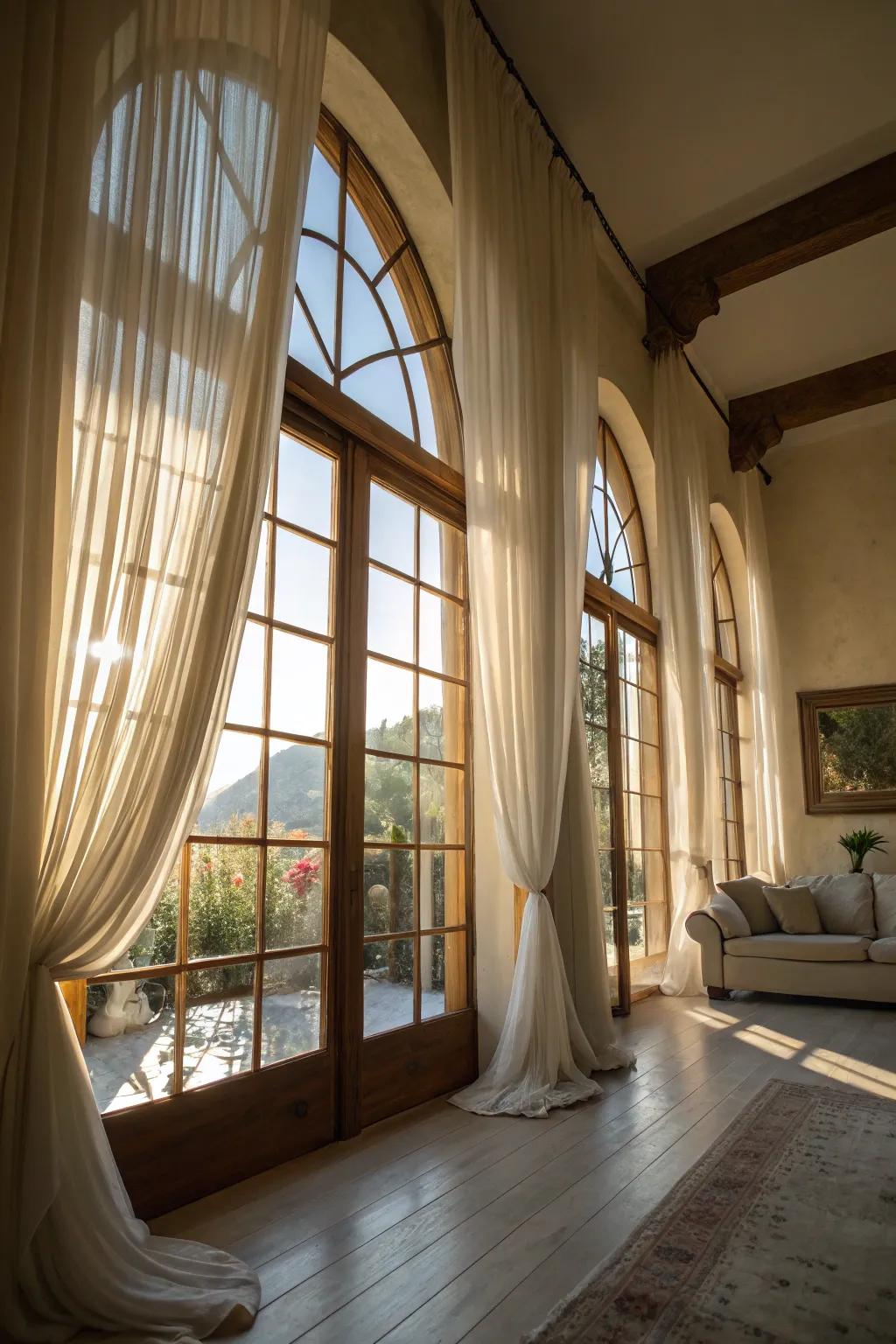 A sunlit space featuring pure veils on arched windows.