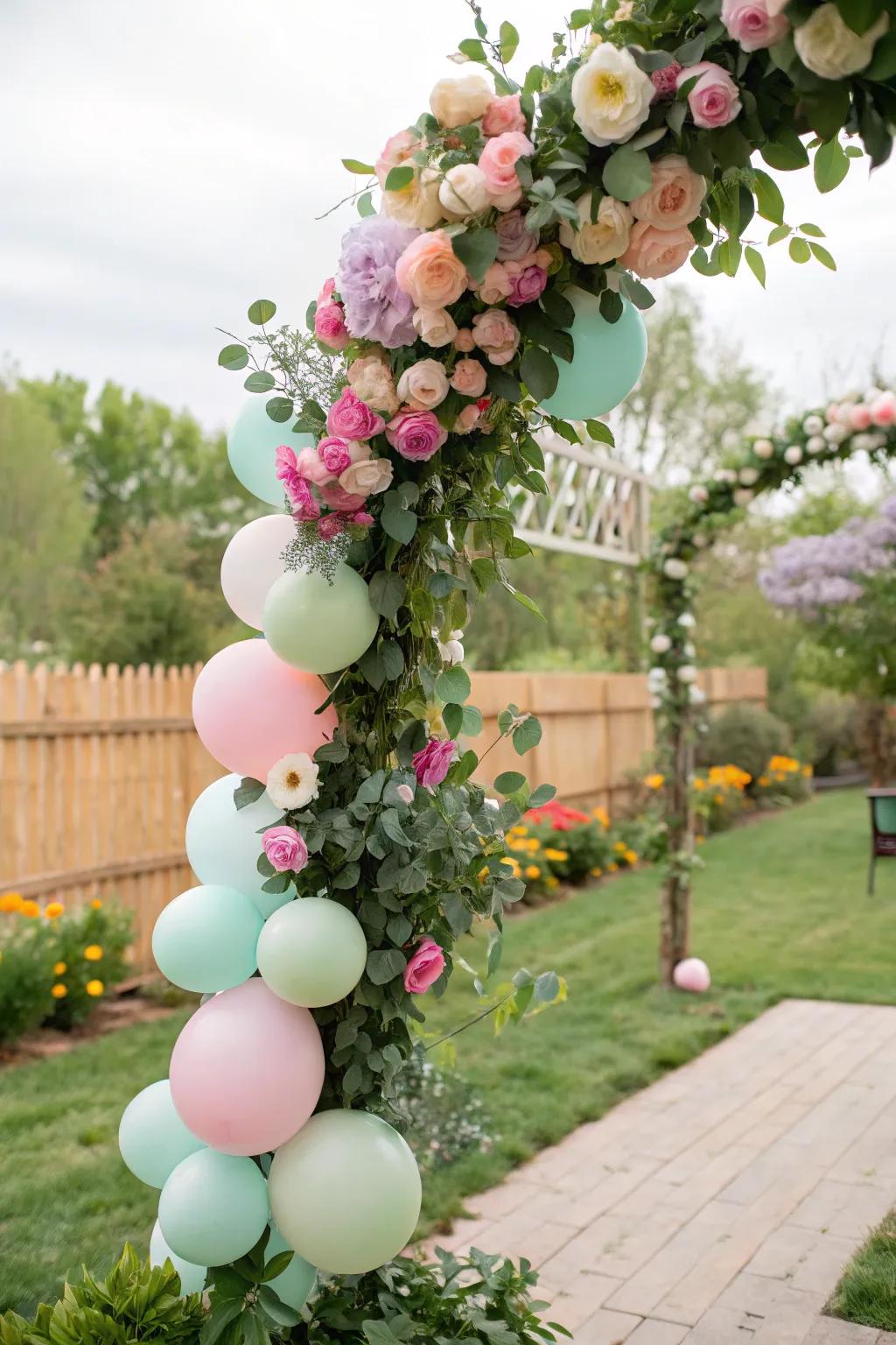 Garden chic balloon garland featuring natural touches.